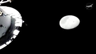 The Moon is seen from a camera outside the Orion spacecraft as the Artemis II astronauts surpass the farthest distance ever travelled by humans from the Earth